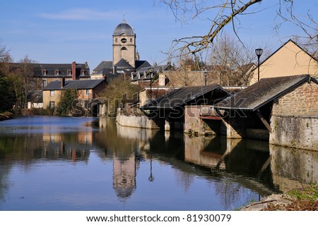 The river Sarthe with the basilica Notre Dame and two wash houses at Alençon of the Lower Normandy region in France