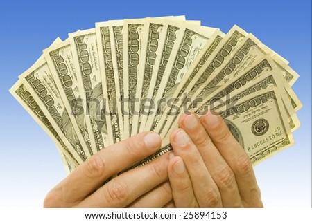 money concept. dollars in hands over blue background