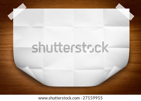 paper background on the wood with page curl