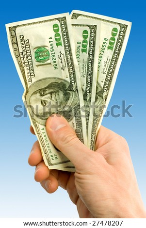 finance concept. money with hand over blue bckground