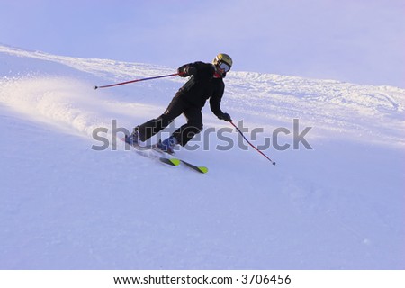 Mountain-skier sliding on the flank of hill