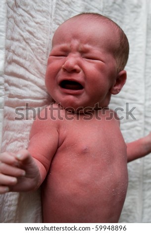Crying boy at the age of one week