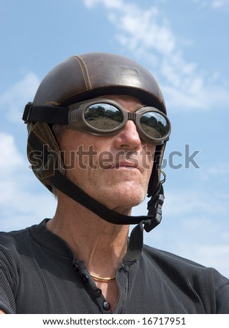 Mature weird man wearing an obsolete helmet