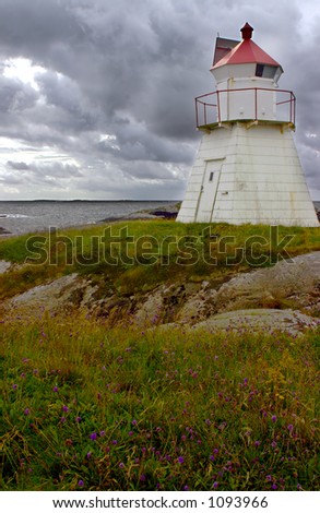 Dark clouds and lighthouse in Norway