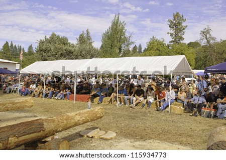 WEST POINT, CA - OCTOBER 6: unidentified audience at Lumberjack day antique axe throwing and log cutting event at the 38th Lumberjack day, on October 6, 2012 in West Point.