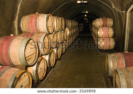 Wine barrels in a storage cave at a winery in Napa Valley