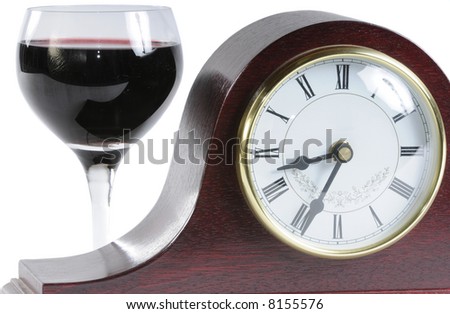 mantle clock and a glass of wine symbolizing time for a drink