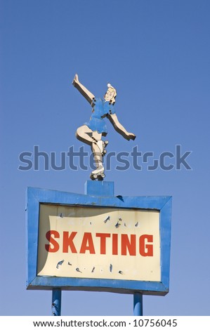 A now out of business roller skating rink billboard, it illustrates the sign of the times with the disapperance of roller skating