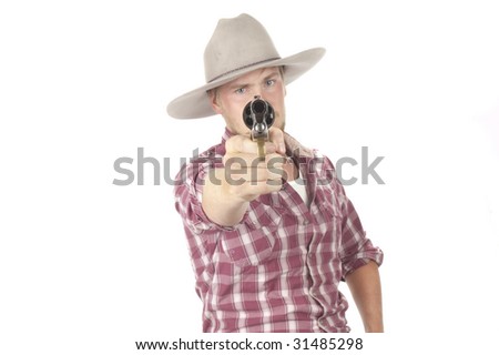 young cowboy with pistol pointed directly at camera, and revolver is muzzle is in focus with shallow DOF so cowboy is slightly soft
