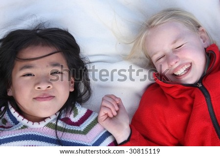Close up of face of happy children while smiling /laughing and playing together