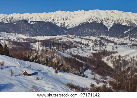 beautiful winter landscape with a mountain village. Village Pestera , Bran, Romania