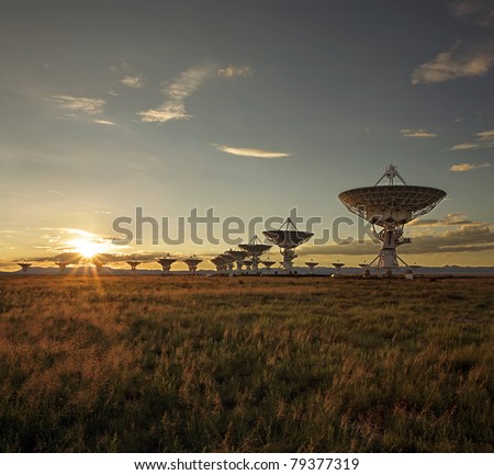 The Very Large Array, which is a large array of satellite dishes that is used to probe deep space (from Contact), is seen at sunset.