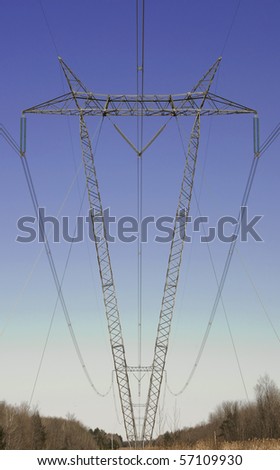 Power Lines Supported by V Shaped Towers Passing Through a  Wooded Area