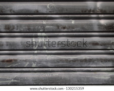 Non-seamless background texture of metal rolling shutters with graffiti