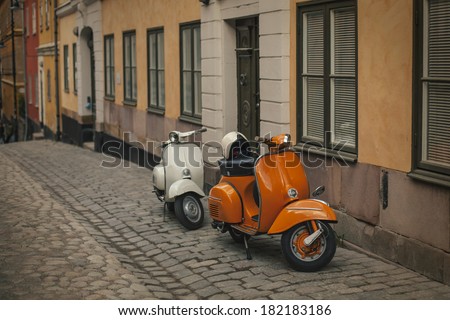 Photo retro scooters in the old town of Stockholm. Effect retro film