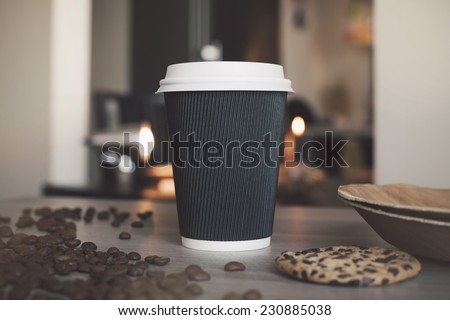 Blank paper cup of coffee in a coffee shop for the application logo