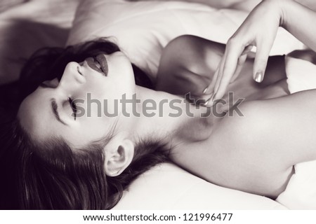young beautiful sexy woman lying in bed. portrait