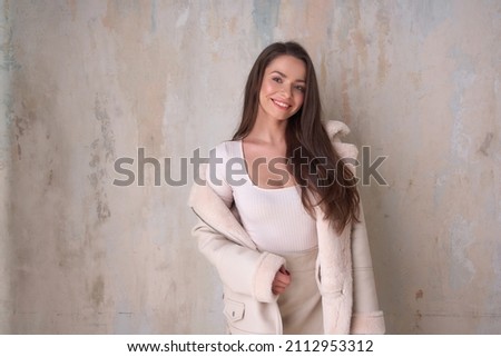 Similar – Image, Stock Photo Long haired woman standing on railways overgrown with dry grass