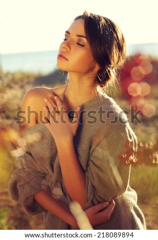 sensual tender woman portrait in autumn yellow colours field. Model with closed eyes
