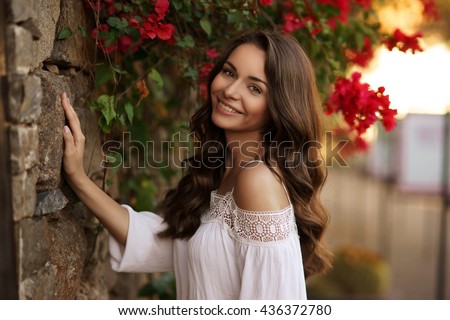 Similar – Image, Stock Photo Lovely curly woman with combed hair, keeps hand in pocket