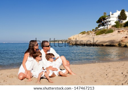 Young beautiful family with two kids on vacation