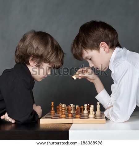 Image, Stock Photo Serious boy playing on smartphone