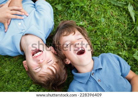 Portrait of two happy brothers in summer park