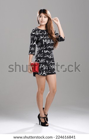 Asian Model in half Sleeves black and white Alphabet Printed Stylish Casual Jumpsuit Rompers with sling red bag.