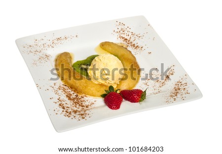 Dessert of banana, ice-cream, caramel, strawberry and mint
