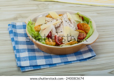Caesar salad with chicken and iceberg salad