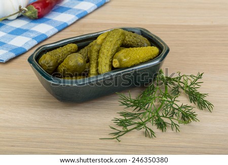 Pickled small cucumber with dill and spices