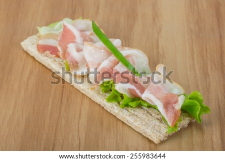 Bacon sandwich with crisp and salad leaves