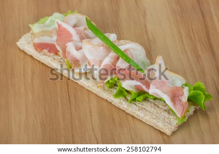 Bacon sandwich with crisp and salad leaves