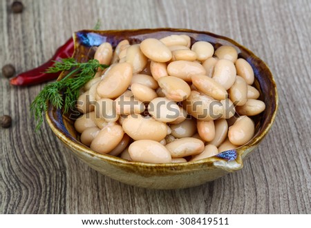 Canned white beans with green fresh dill leaf