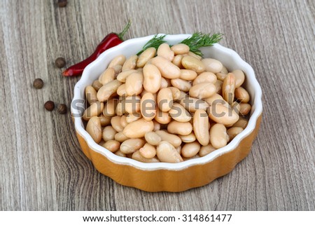 Canned white beans with green fresh dill leaf