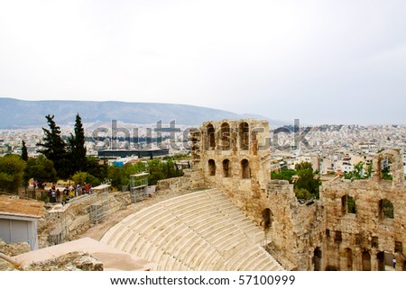 ncient theatre of Herodes Atticus is a small building of ancient Greece used for public performances of music and poetry, below on the Acropolis and in background dwelling of metropolis Athens