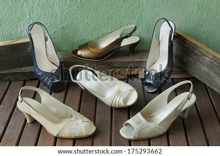 shoes white, black and brown peep toe with a low heel  on wooden floor