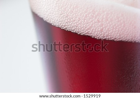 Close up shot of fruit beer on a white background