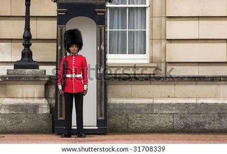 LONDON - JUNE 06: A Royal Guard at Buckingham Palace on 06 June 2009 in London, England.