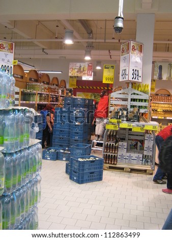 PRAGUE, CZECH REPUBLIC - SEPTEMBER 14: Supermarket Employees remove bottles following the ban of hard spirits because of the bootleg (Methanol) scandal, on September 14, 2012 in Prague, Czech Republic