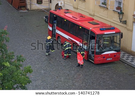 PRAGUE, CZECH REPUBLIC - JUNE 2: Fire brigade setting up bus to serve as head quarters in the flooded Malastrana district, Prague, on June 2, 2013 in Prague, Czech Republic