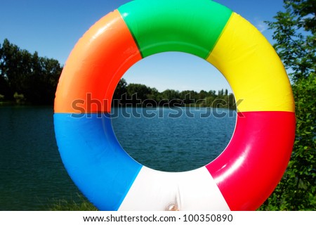 swim ring floating on beautiful blue lake