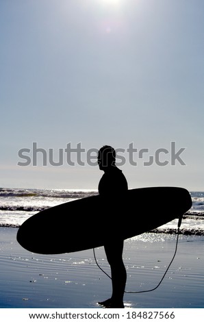 surfing at a nice beach outside at the sea