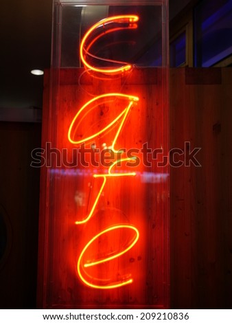 yellow orange lighting letters as sign for a cafe