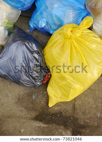 Many Garbage Plastic Bags With Different Colors Piled Up