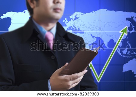 Businessman holding a book in hand : Data source: NASA
