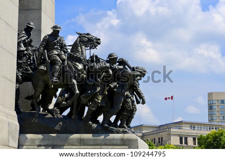 The National War Memorial known as The Response, is a granite cenotaph with bronze sculptures of 23 figures in war.