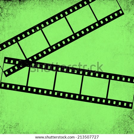 Textured old paper background with films strips  -  Vintage film stripe abstract green background