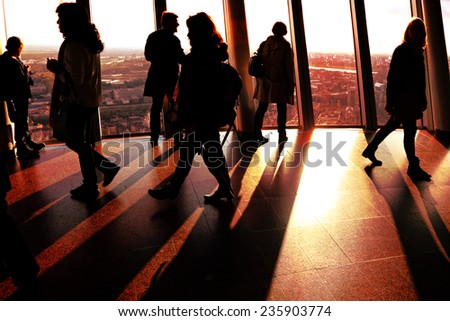GERMANY,DUSSELDORF-OCTOBER,10: Silhouettes of people on Rhine Tower observation point at sunset.Rhine Tower - 240.5 meter, the best rotating view point for town supervision,Germany,on October 10,2014