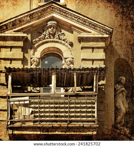 Renaissance architectural fragment with female sculptures of a residential building. Europe. Architectural theme. Image done on paper texture. Grunge textured photo